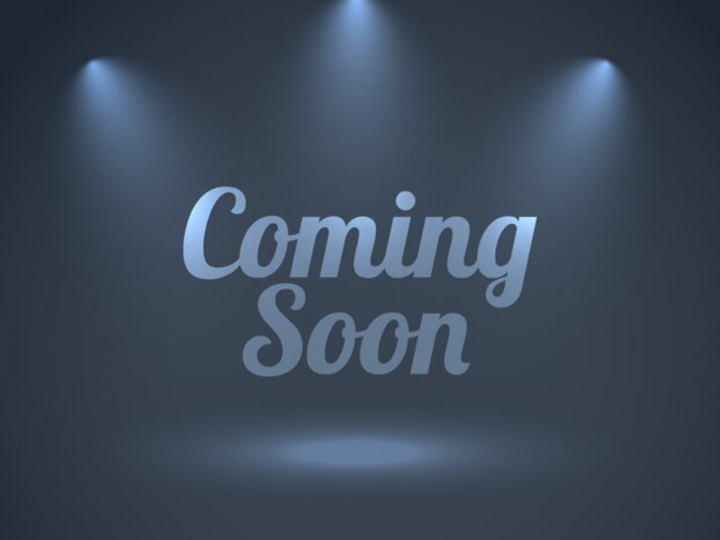 "Coming Soon" under spotlights